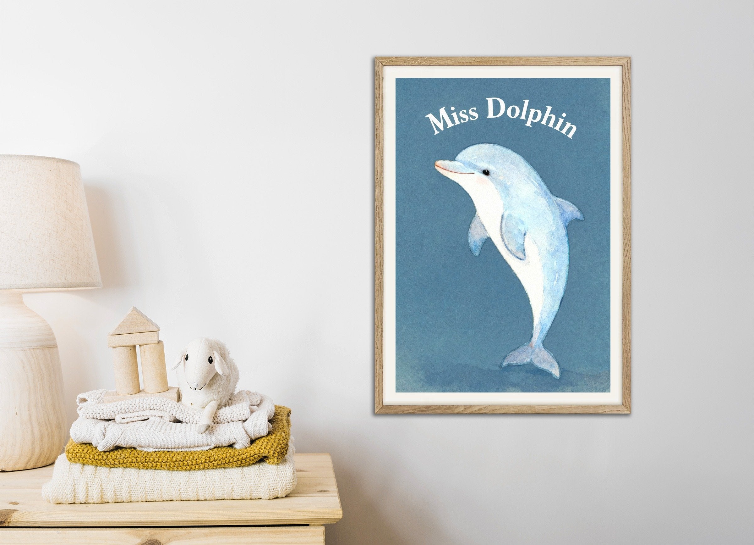 Poster of Nursery dolphin wall art – Playful ocean animal, with natural wooden frame